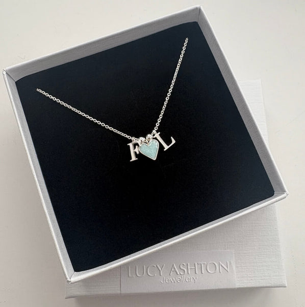 bespoke personalised necklace made of two initials and a blue heart breastmilk charm on sterling silver chain