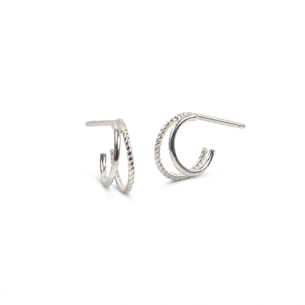 A pair of silver-toned textured double hoop earrings with post backings, displayed on a clean white background.