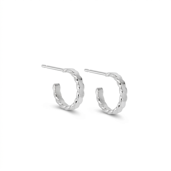 A pair of textured silver hoop earrings with post backs, shown on a clean white background.
