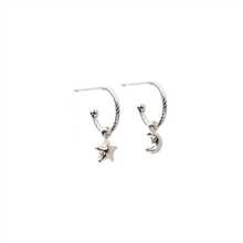 Load image into Gallery viewer, A pair of silver-toned twisted hoop earrings, one featuring a dangling star charm and the other a crescent moon charm, shown on a plain white background.

