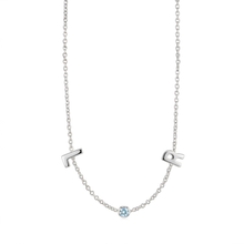 Load image into Gallery viewer, A delicate silver chain necklace featuring three charms: a stylized letter 'H' on the left, a stylized letter 'R' on the right, and a small round light blue gemstone in the center, shown against a plain white background.
