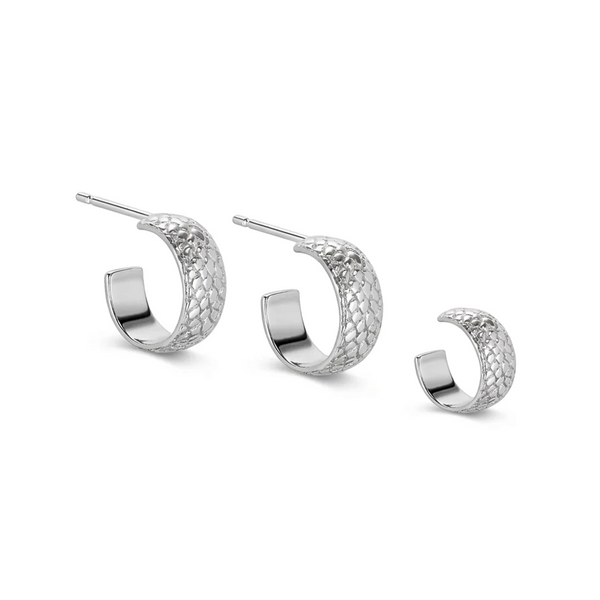 snake print texture on small hoop earrings and matching ear cuff on a white background