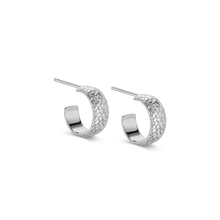 Load image into Gallery viewer, A pair of silver hoop earrings with a textured, woven or scale-like pattern on the outer curve, shown on a plain white background.
