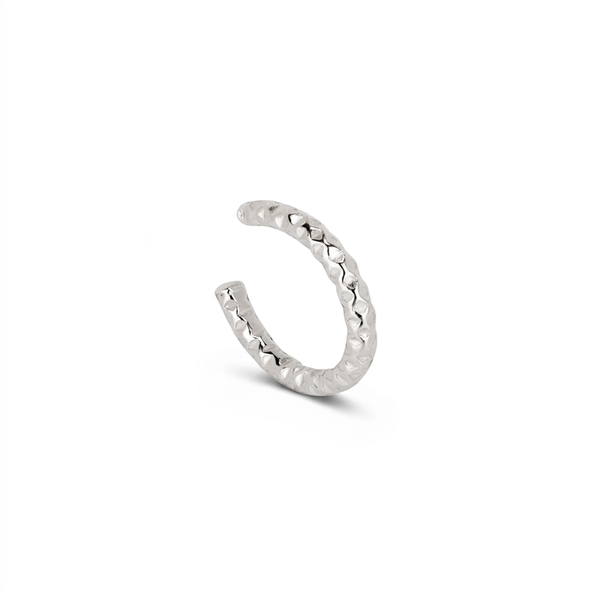 A silver textured open-ended ear cuff with a hammered finish, displayed on a clean white background.