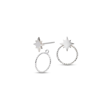 Load image into Gallery viewer, A pair of silver-toned star stud earrings on a plain white background. One earring features a flat starburst post, and the other shows a textured circular hoop with a starburst stud attached.
