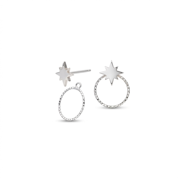 A pair of silver-toned star stud earrings on a plain white background. One earring features a flat starburst post, and the other shows a textured circular hoop with a starburst stud attached.