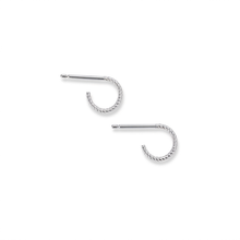 Load image into Gallery viewer, A pair of silver-toned twisted hoop earrings with straight posts, displayed on a clean white background.
